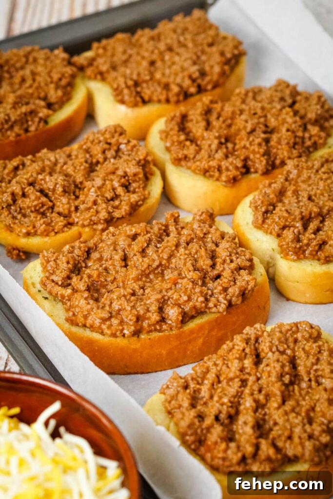 Garlic Bread Sloppy Joes: Cheesy, Savory Sloppy Joe Twist 7 A tray of freshly baked garlic bread heaped with the ground beef mixture.