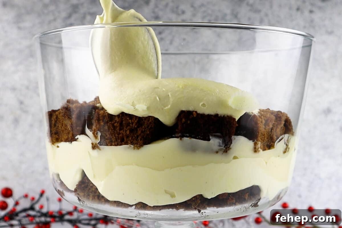Gingerbread Trifle Recipe: Festive Layered Dessert for Holidays 16 adding second layer of eggnog pudding to trifle.