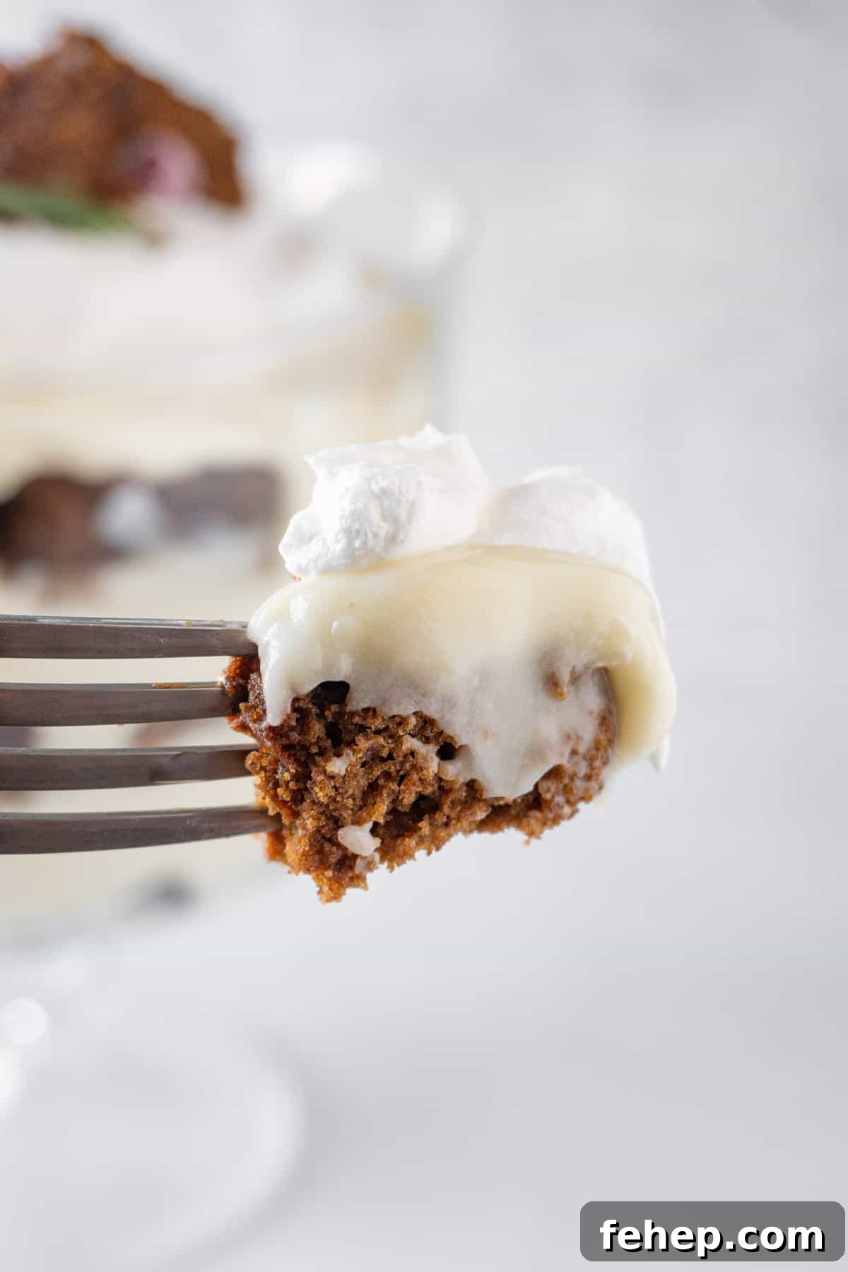 Gingerbread Trifle Recipe: Festive Layered Dessert for Holidays 3 gingerbread trifle on fork, showing a bite of different layers.