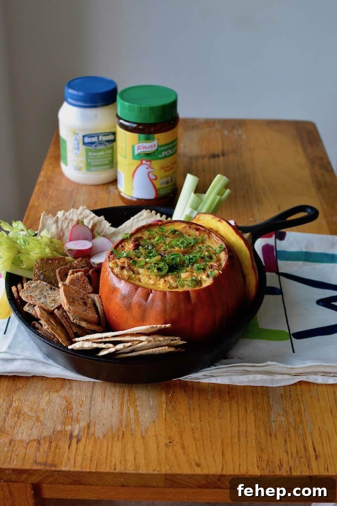 Baked Pumpkin Dip with Mexican Street Corn Flavor 2 This Mexican Street Corn Dip baked in a pumpkin is our new go-to appetizer for fall. Creamy, cheesy corn with layers of spice is delicious and adorable too! #Mexicanstreetcorn #elotes #corndip #pumpkin #fall #streetcorndip #hotcorndip