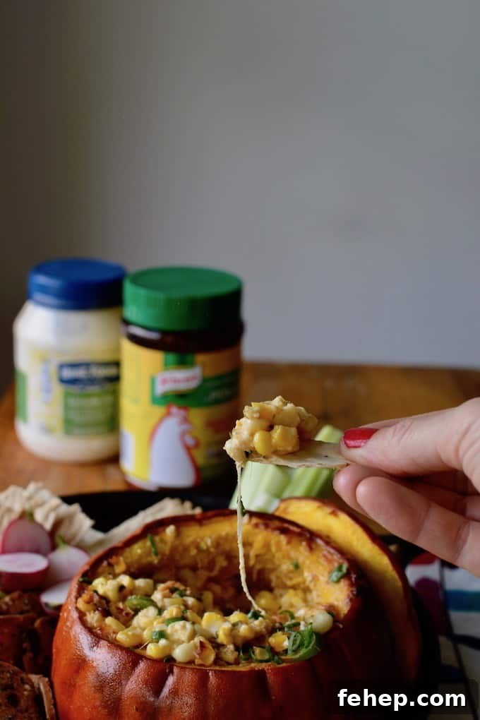 Baked Pumpkin Dip with Mexican Street Corn Flavor 3 This Mexican Street Corn Dip baked in a pumpkin is our new go-to appetizer for fall. Creamy, cheesy corn with layers of spice is delicious and adorable too! #Mexicanstreetcorn #elotes #corndip #pumpkin #fall #streetcorndip #hotcorndip