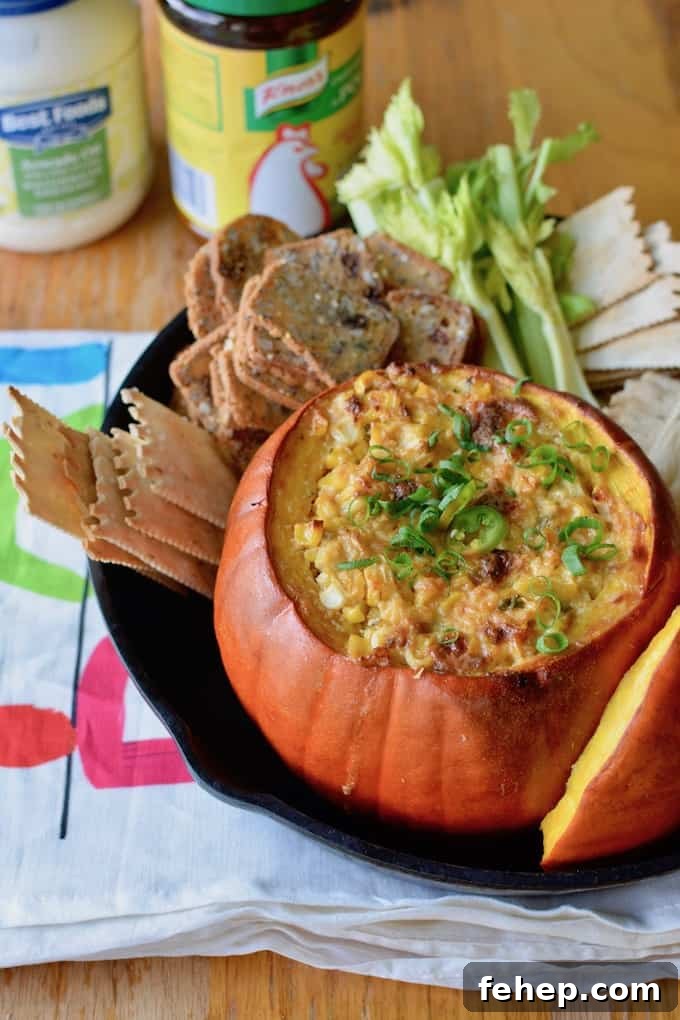 Baked Pumpkin Dip with Mexican Street Corn Flavor 5 This Mexican Street Corn Dip baked in a pumpkin is our new go-to appetizer for fall. Creamy, cheesy corn with layers of spice is delicious and adorable too! #Mexicanstreetcorn #elotes #corndip #pumpkin #fall #streetcorndip #hotcorndip