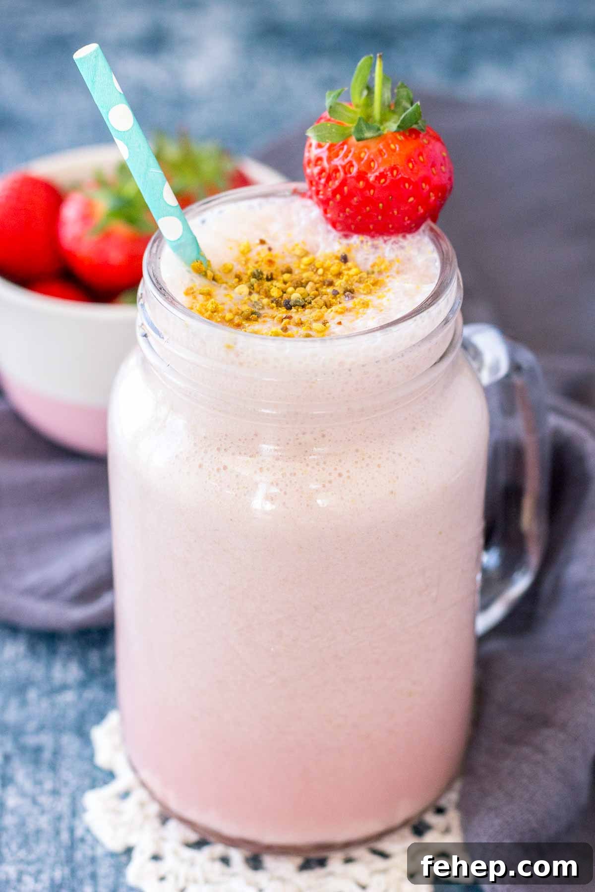 Strawberry Milk served in a tall glass with a straw