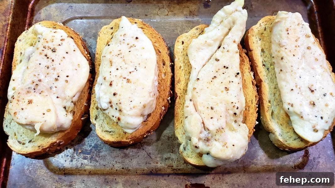 four pieces of toast topped with chicken.