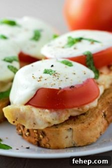 two Open Face Chicken Caprese Sandwiches on a plate.