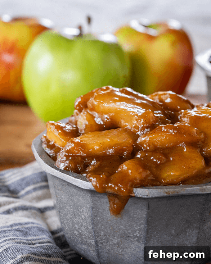 Simple 3-Step Leftover Turkey Casserole Recipe 4 Cooked apple pie filling in a metal bowl with apples behind it