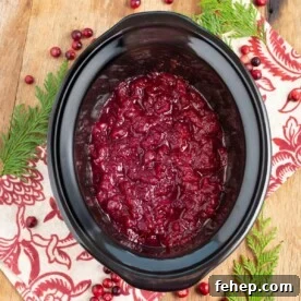Slow Cooker Cranberry Sauce in a black crock