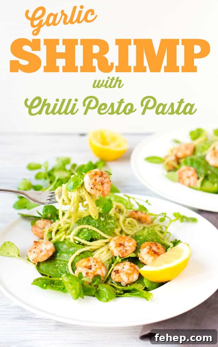 Garlic Shrimp with Chilli Pesto Pasta - Skip the jarred spaghetti sauce! Homemade pesto is the best complement for these sweet and spicy shrimp on a bed of noodles and baby spinach.