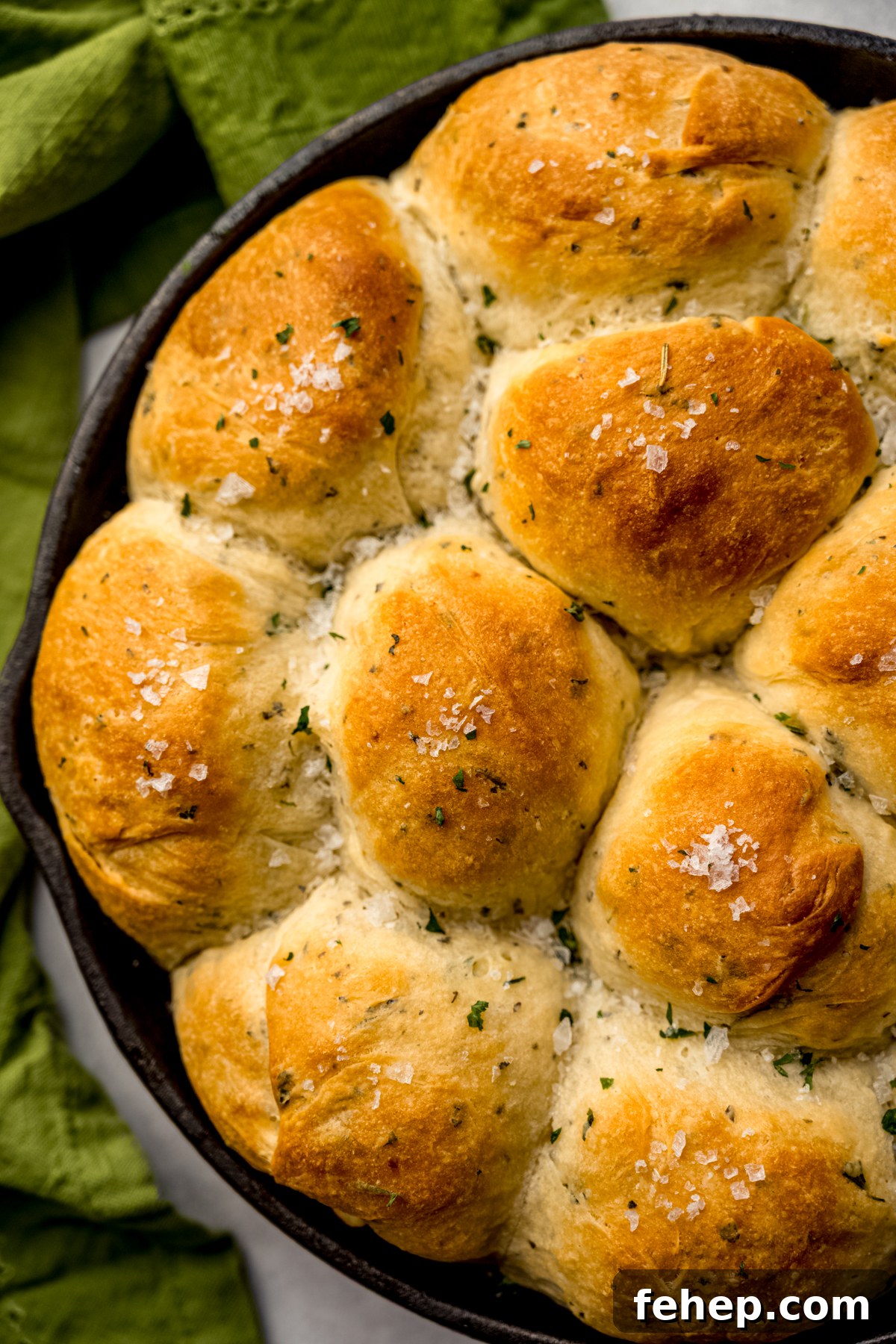 A skillet of herbed dinner rolls.