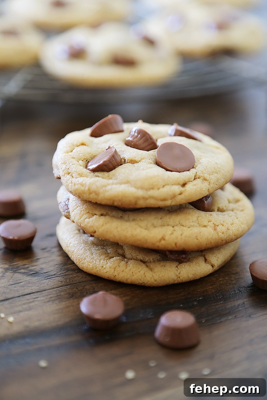 Soft Peanut Butter Cup Cookies - Perfectly soft and chewy peanut butter cookies, with gooey chocolate peanut butter cups hidden inside! Thecomfortofcooking.com