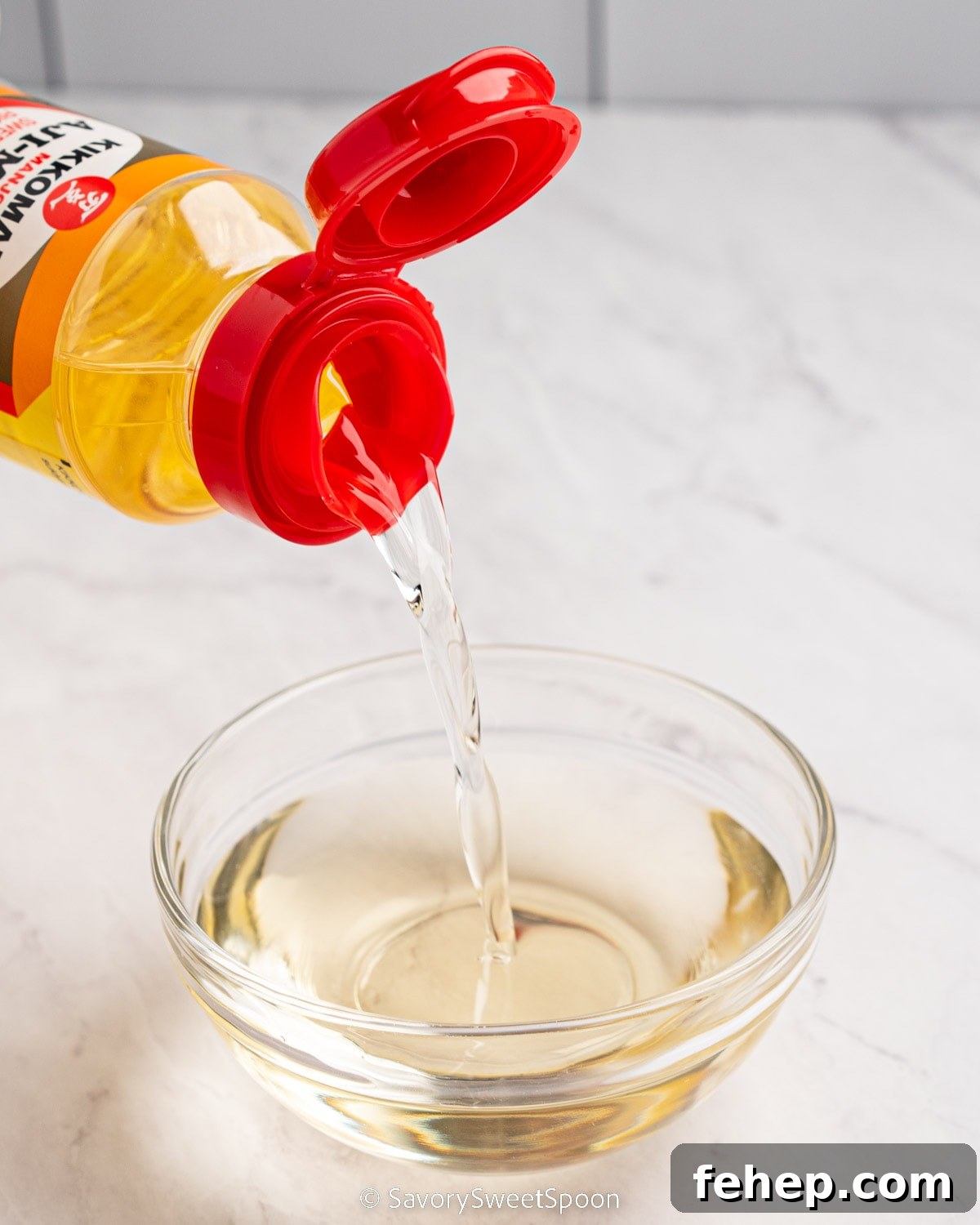 What to Use Instead of Mirin: 9 Flavorful Substitutes 3 Bottle of mirin pouring into glass bowl.