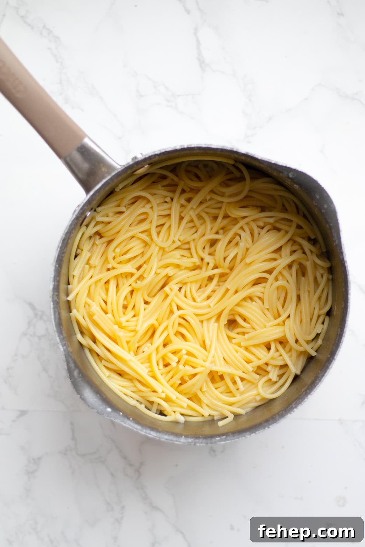 plain spaghetti noodles in a pot