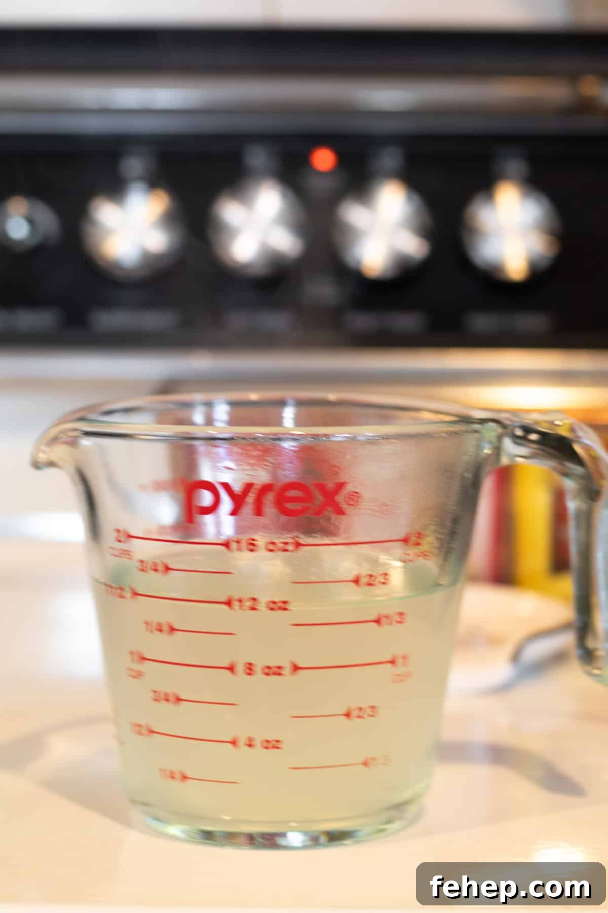 pasta water in a glass measuring cup