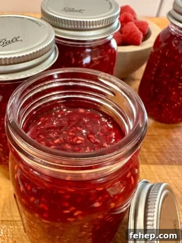 Easy small batch raspberry jam in jars.