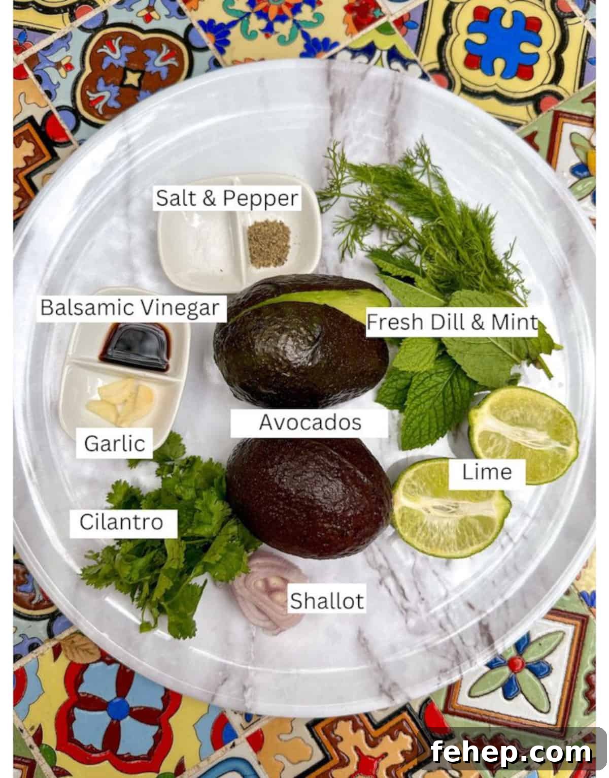 Ingredients for guacamole without tomatoes arranged on a plate.