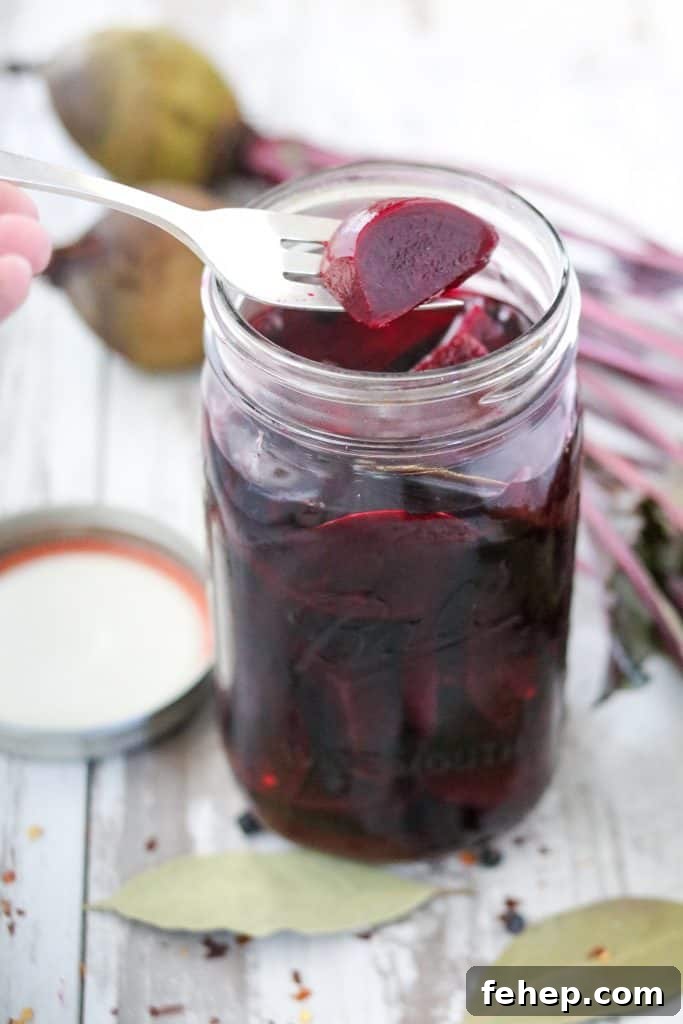 Modern Scandinavian Christmas Eve Smorgasbord Menu Ideas 12 A jar filled with pickled beets and a fork