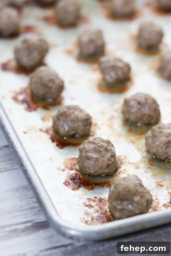 Modern Scandinavian Christmas Eve Smorgasbord Menu Ideas 6 A close up of cooked meatballs on a sheet pan