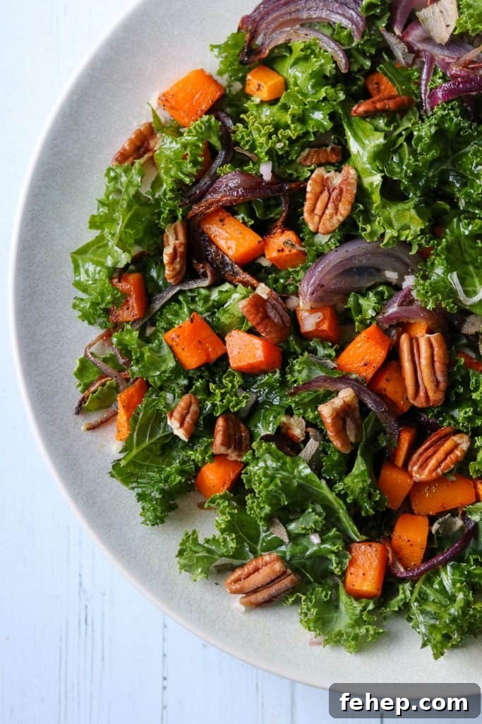 Modern Scandinavian Christmas Eve Smorgasbord Menu Ideas 9 Kale salad with roasted butternut squash and pecans on a plate