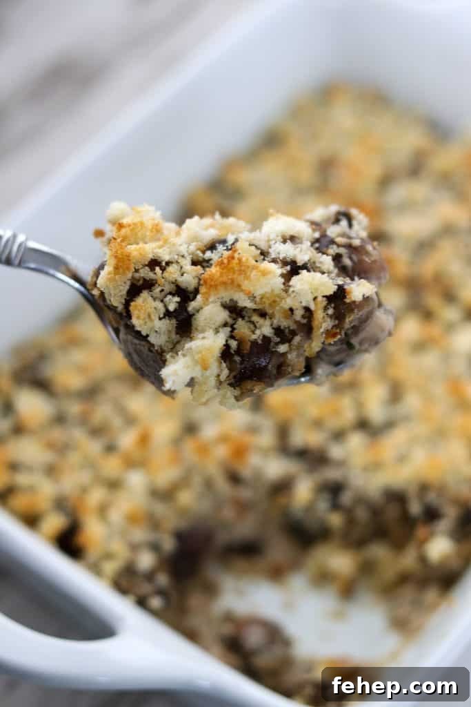 Modern Scandinavian Christmas Eve Smorgasbord Menu Ideas 10 A close up of mushroom gratin on a spoon