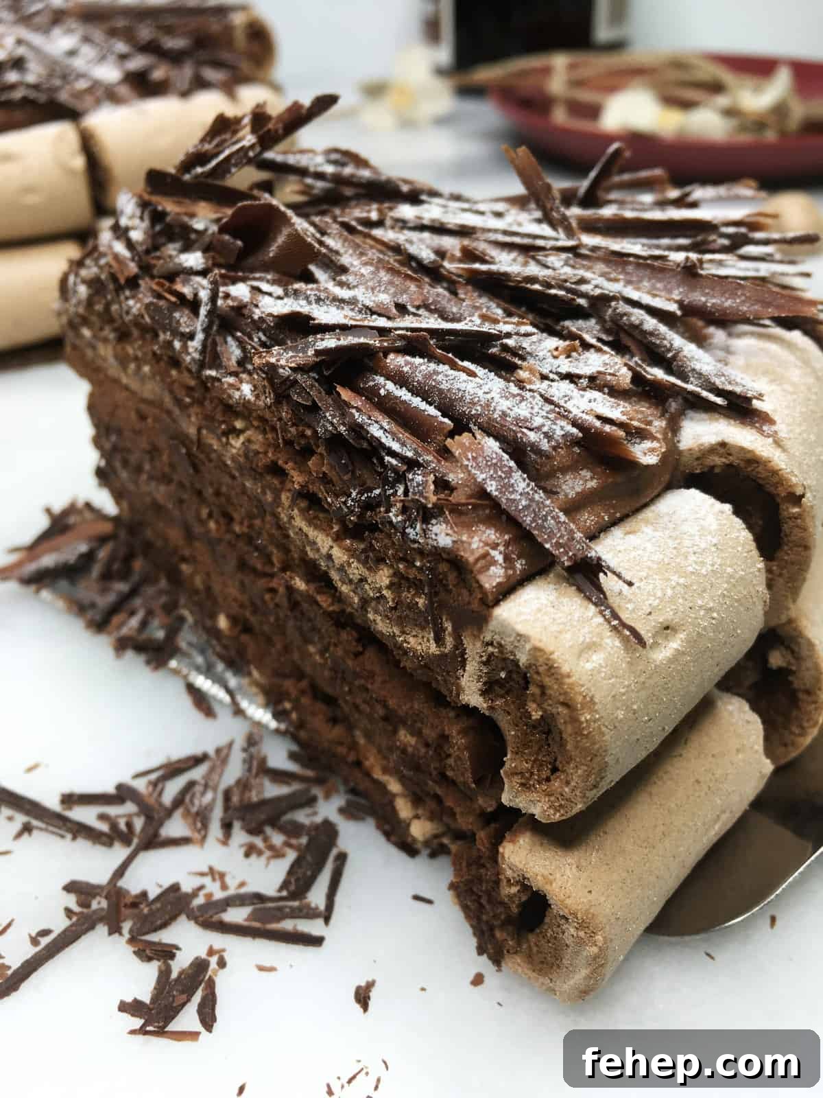 15 Irresistible Cake Recipes for Every Occasion 13 A slice of Concord cake (Gâteau Concorde) with the rest of the cake