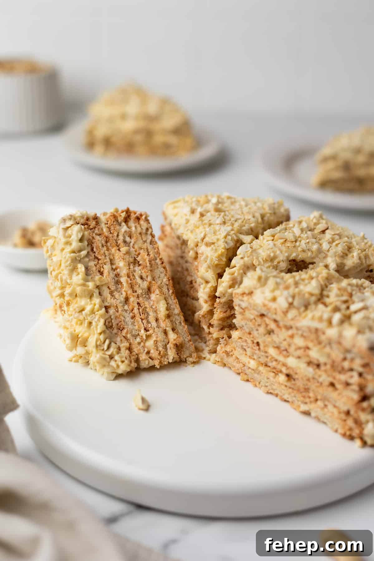 15 Irresistible Cake Recipes for Every Occasion 3 A slice of Sans Rival cake on a black dessert plate