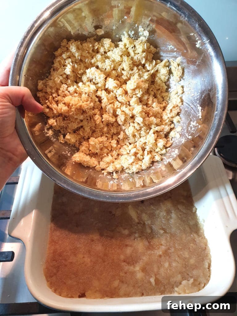 Adding topping mix to crumble