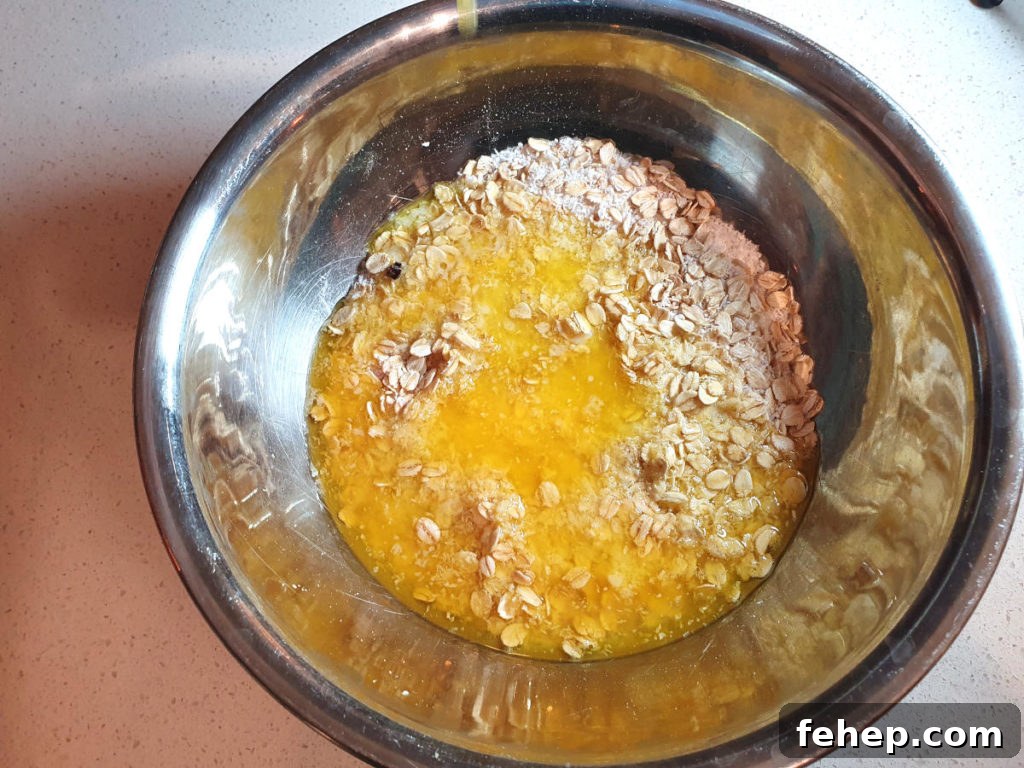 Adding melted butter to crumble topping mix