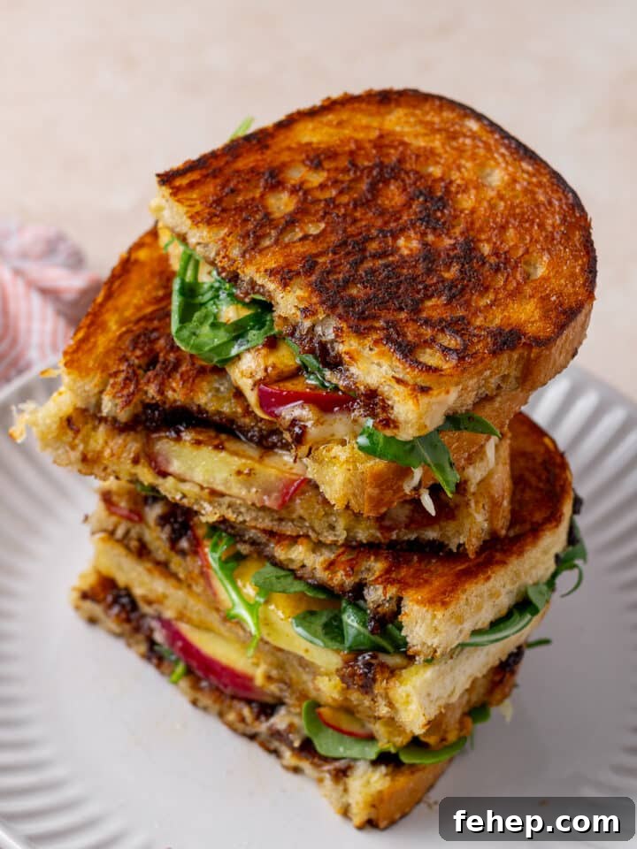 Gruyère Grilled Cheese with Fig Jam and Apple Slices 12 stack of grilled cheese sandwiches with fig and apple and arugula