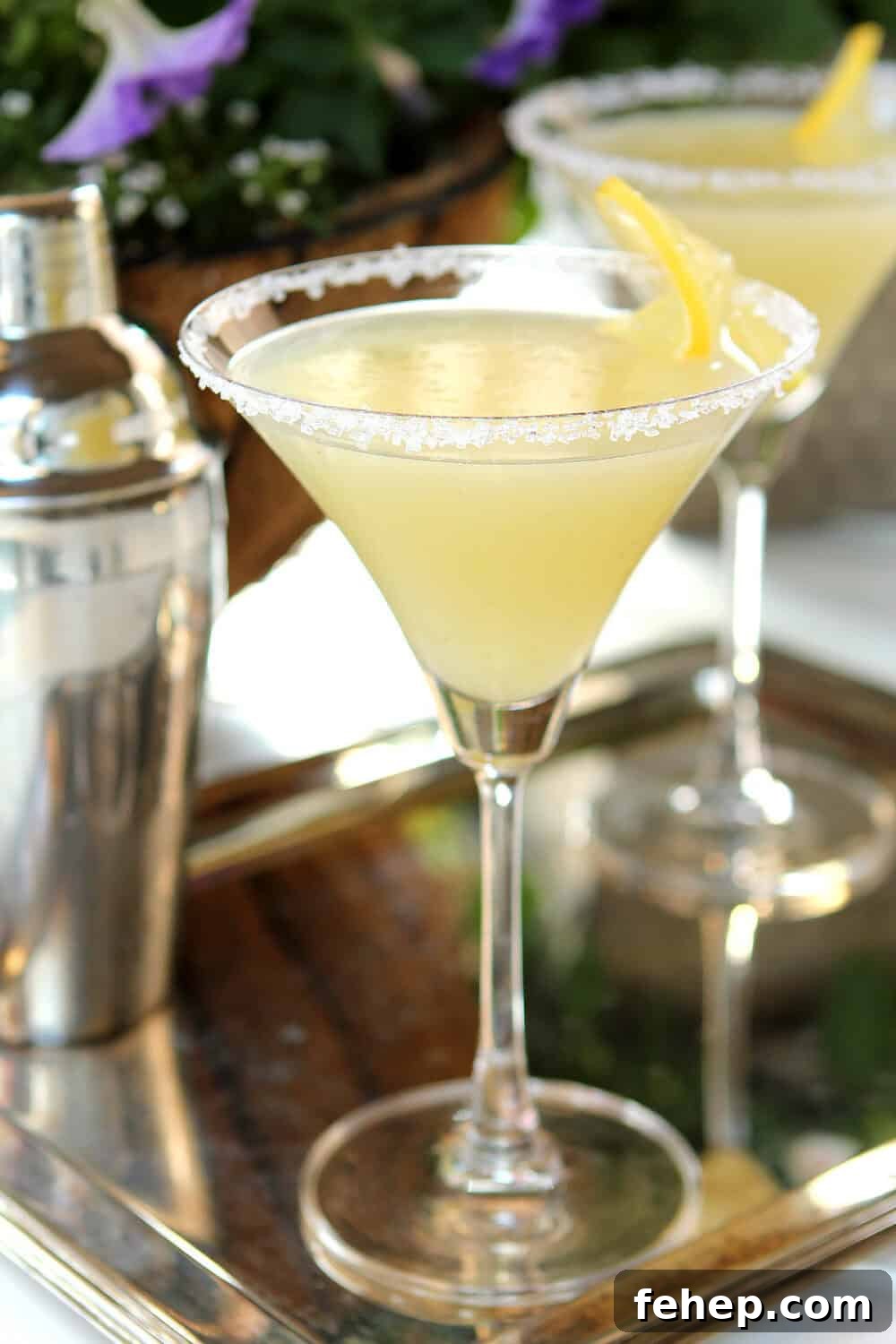 Lemon Drop Martini Served in classic martini glass with a sugared rim and lemon wheel garnish.