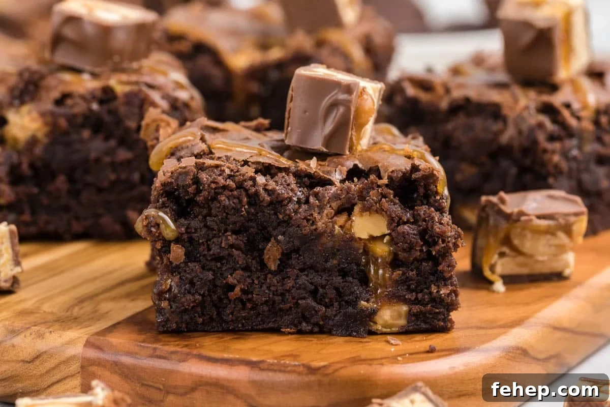 14 Gooey Brownie Recipes That Take Decadence to New Heights 2 Snickers Brownies