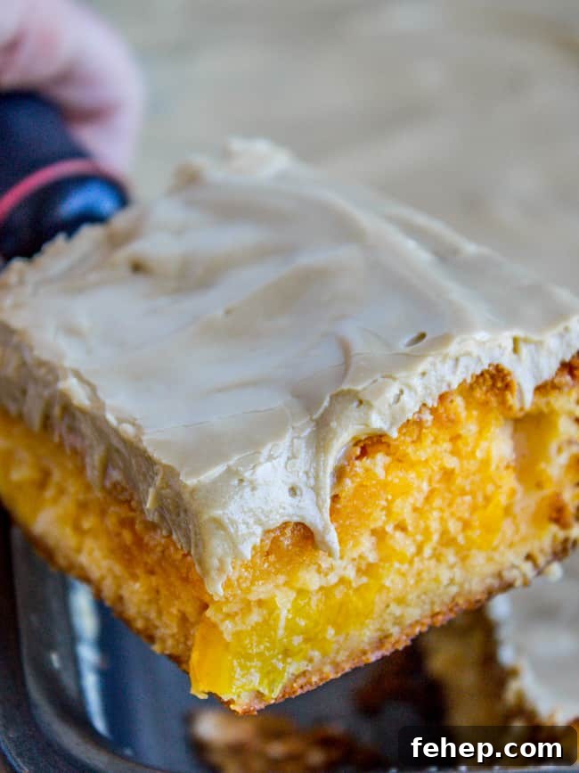 a slice of peach cake with brown sugar frosting.