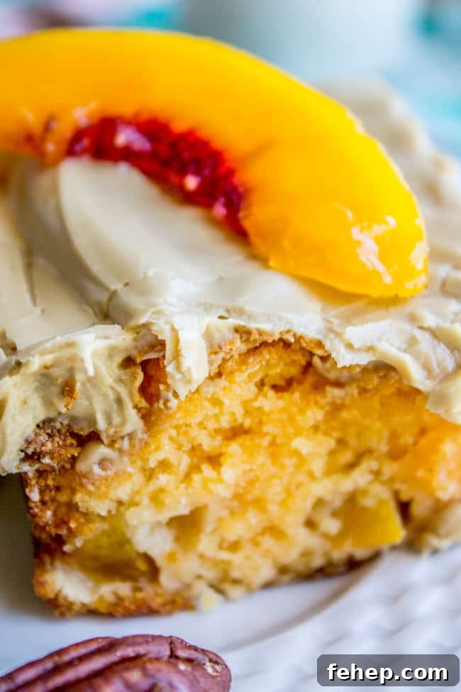 a slice of peach cake with brown sugar frosting.