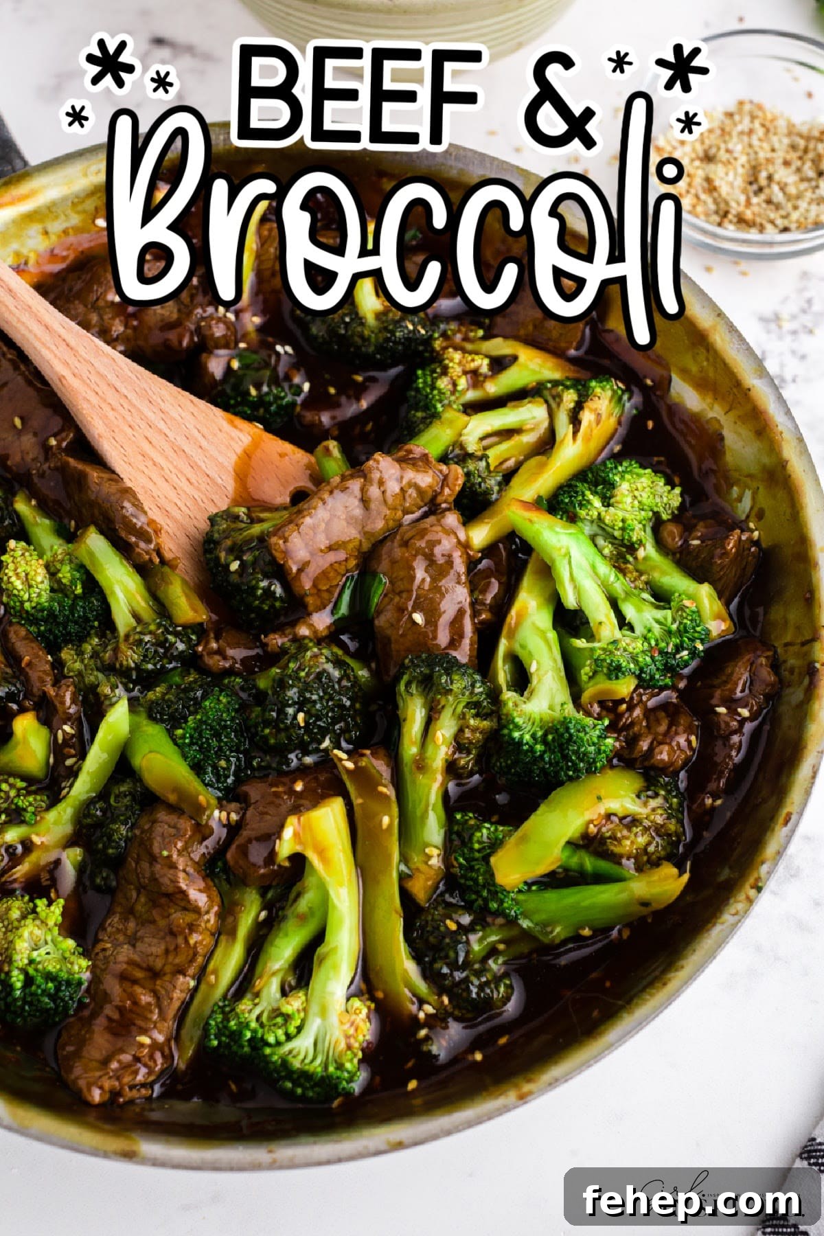 Panda Express Beef and Broccoli Recipe (Copycat Version) 2 Panda Express beef and broccoli in skillet with wooden spatula lifting a scoop, with text overlay.