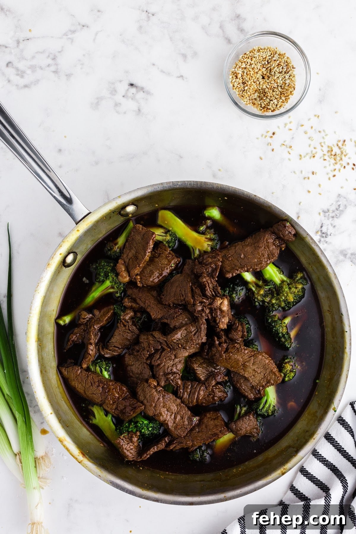 Panda Express Beef and Broccoli Recipe (Copycat Version) 10 Seared beef added into skillet with Panda Express beef and broccoli.