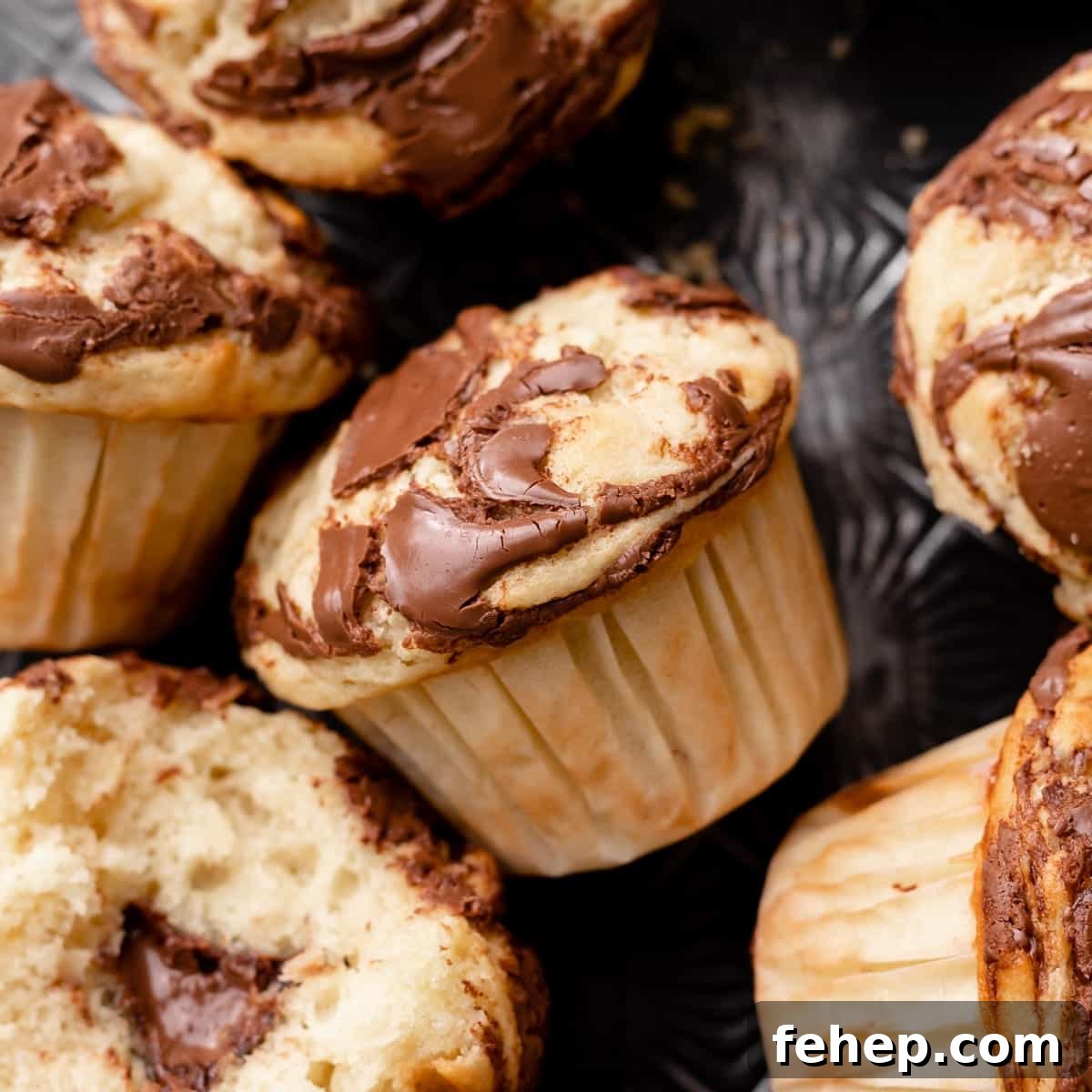 banana nutella muffin with nutella swirled into the top.