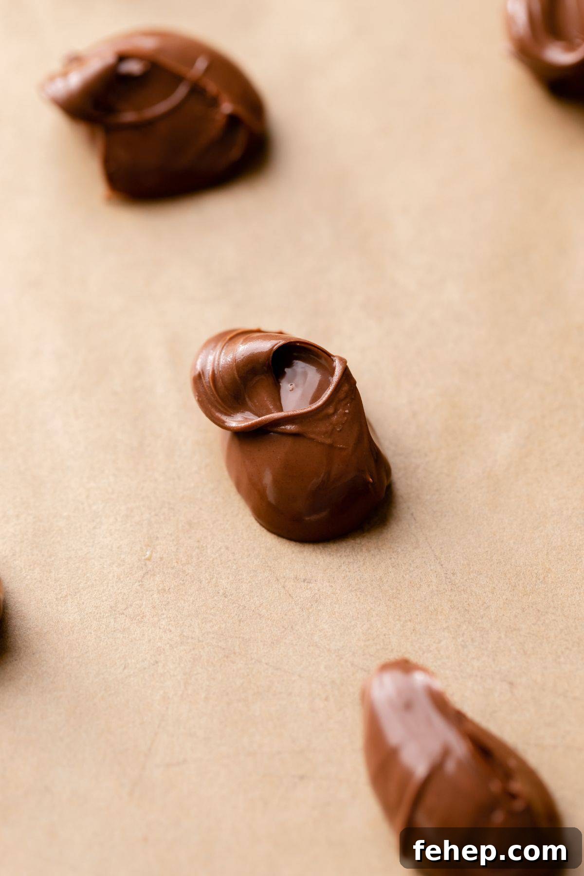 Scoops of nutella on a baking sheet.