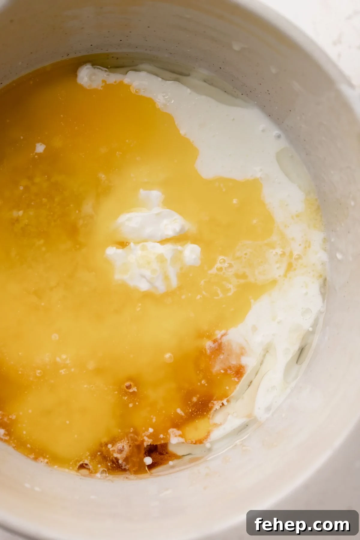 A bowl with the wet ingredients before whisking.