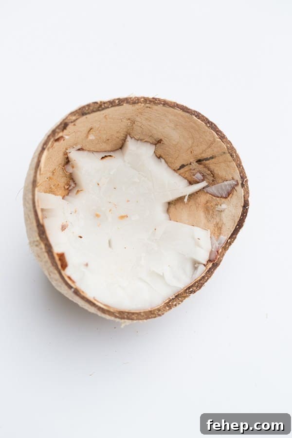 How to Make Stylish Coconut Bowls at Home 4 side shot of coconut with some meat still in it