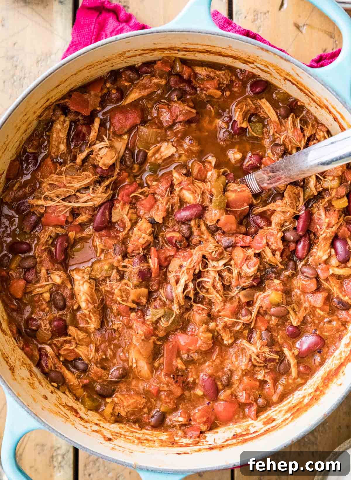 Leftover Turkey Chili Recipe: Comforting One-Pot Meal 4 Overhead view of chili made with shredded turkey, beans, and more.