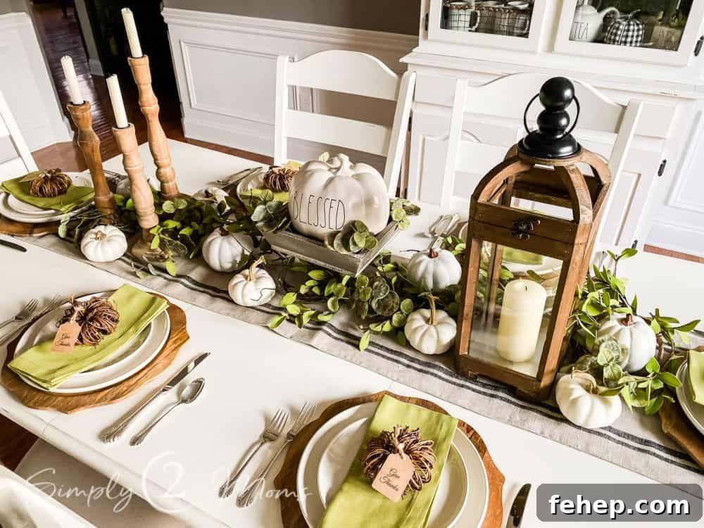 dining table with neutral wood elements and small pumpkins