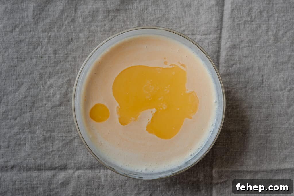 melted vegan butter in a bowl of buttermilk