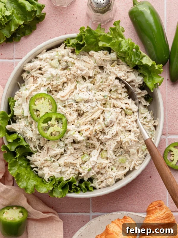 Classic Cape Cod Chicken Salad Recipe for Summer Lunches 14 Jalapeño chicken salad in a shalow bowl with lettuce and garnished with jalapeños.