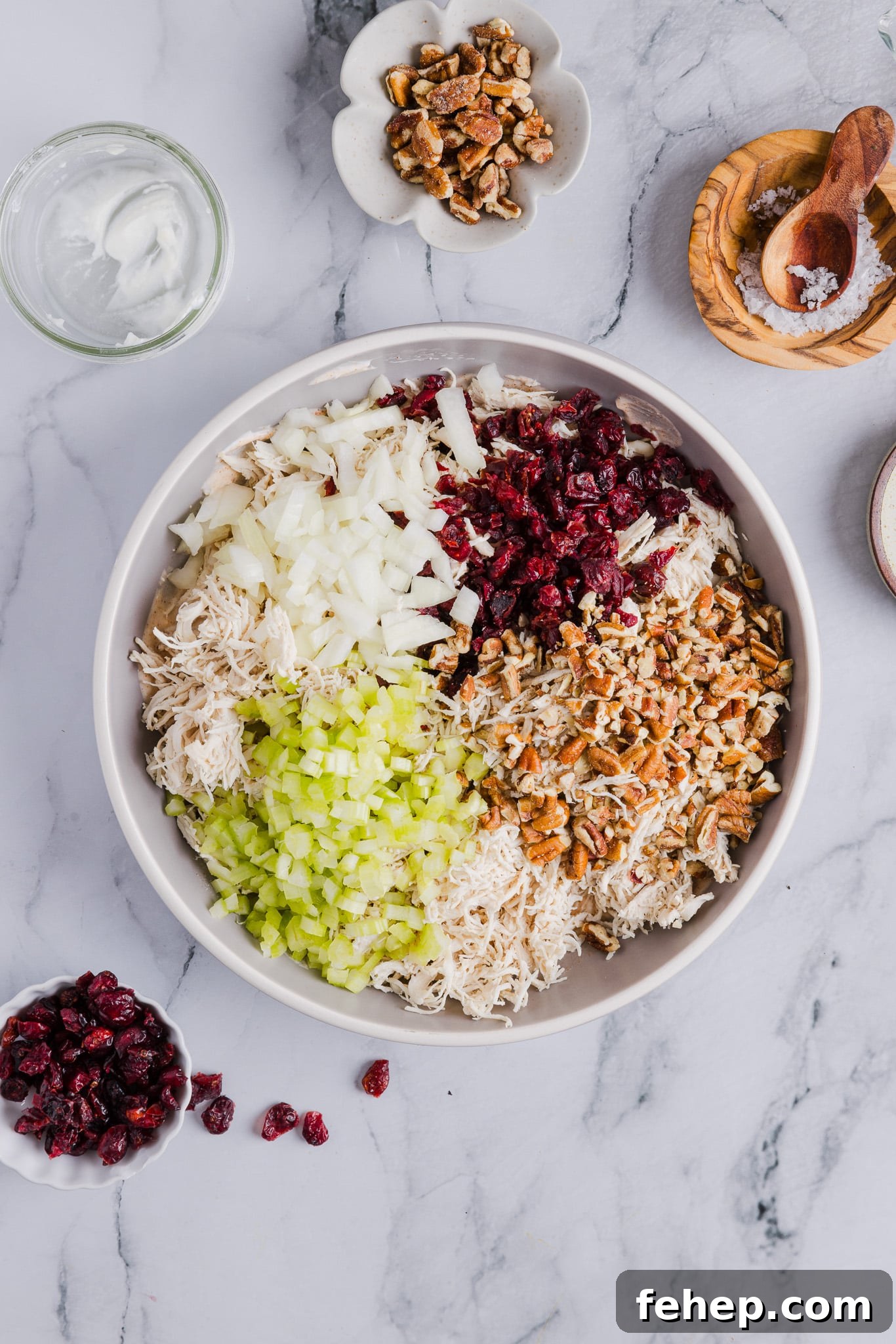 Classic Cape Cod Chicken Salad Recipe for Summer Lunches 6 Ingredients for Cape Cod chicken salad added to a large bowl with dressing.