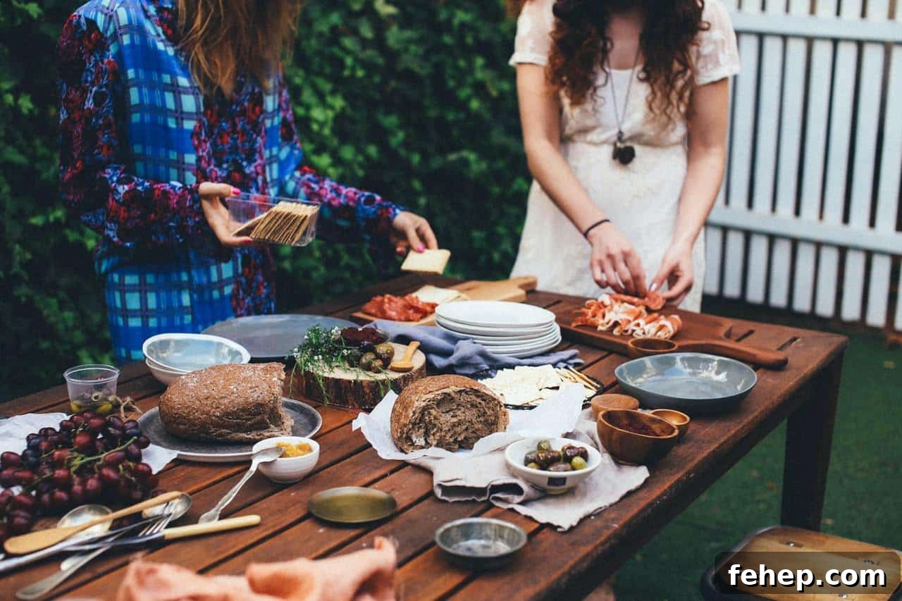 How to Plan a Memorable Surprise Party Guests Will Love 5 Unrecognizable women serving table with assorted appetizers in garden.