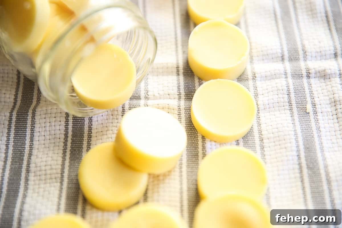 Homemade lotion bars on white and gray towel in a mason jar.
