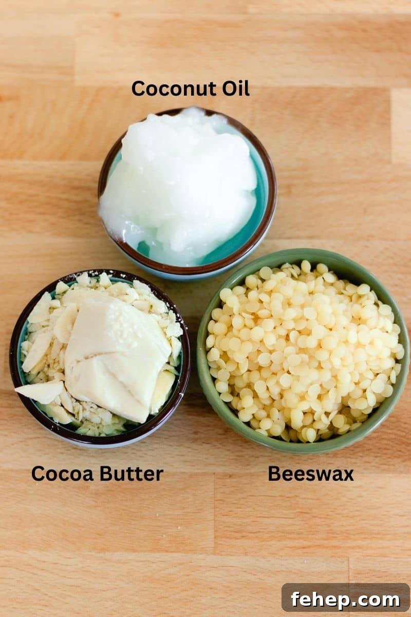 Three bowls of lotion bar ingredients: coconut oil, beeswax, and cocoa butter.