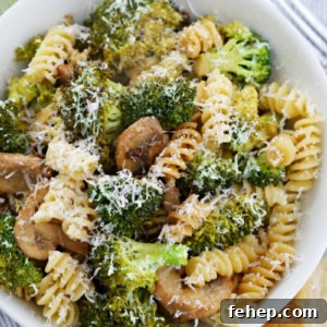 Sun-Dried Tomato Pasta Recipe with Garlic, Basil & Parmesan 2 sun dried tomato pasta in a white bowl