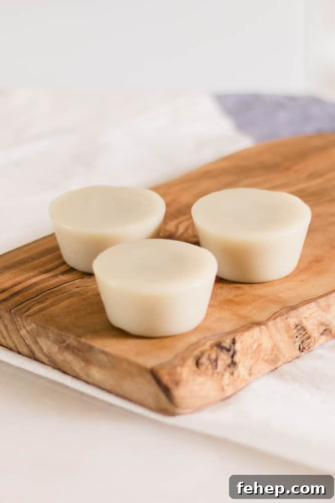 Lotion bars sitting on a wooden tray.