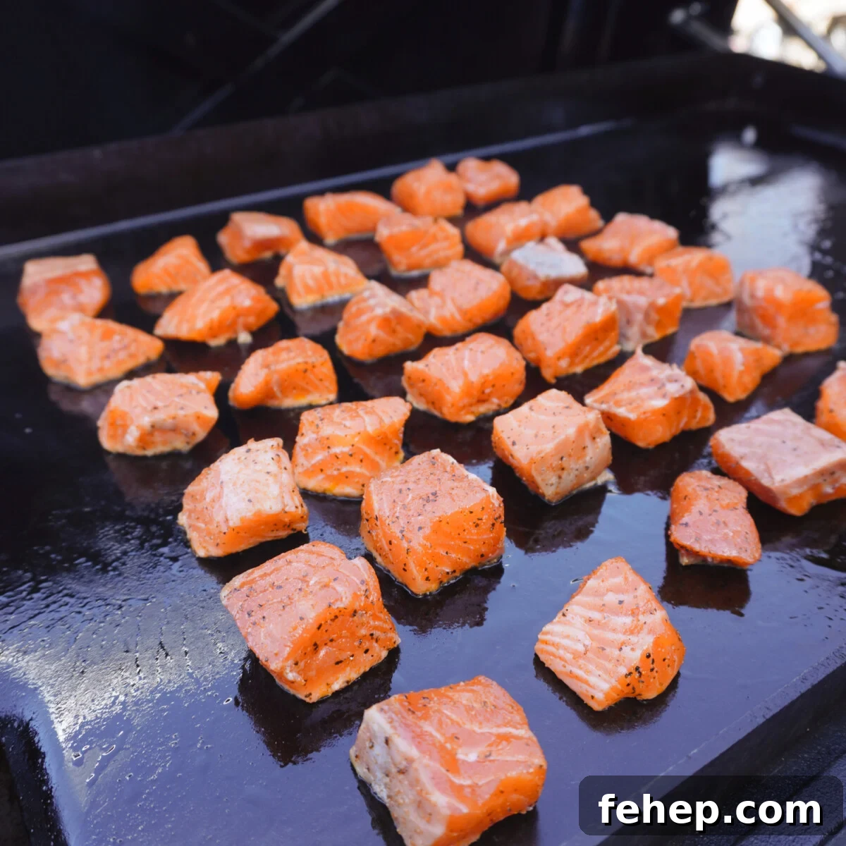 salmon bites on the griddle.