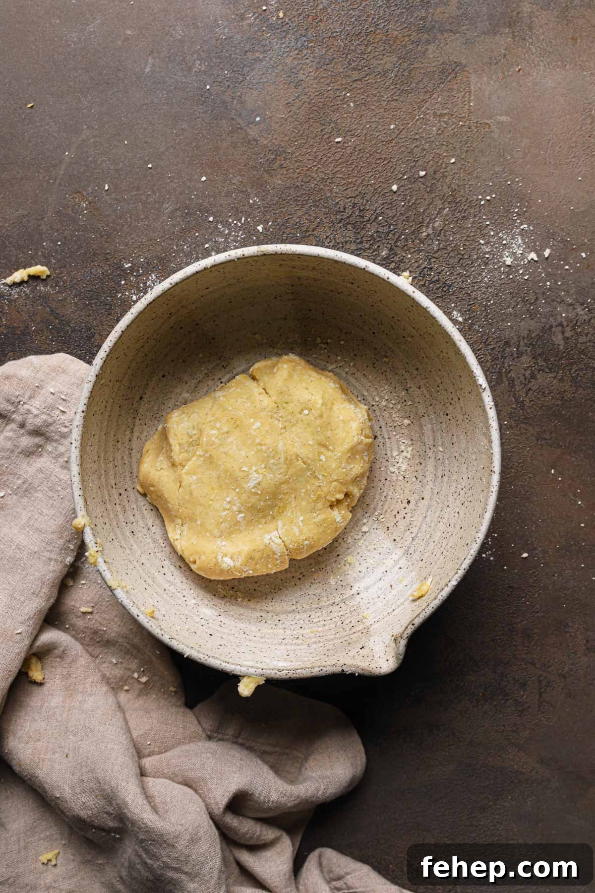 Italian Pasta Frolla Shortcrust Pastry: Multipurpose Dough Guide 12 A large bowl with a piece of dough.